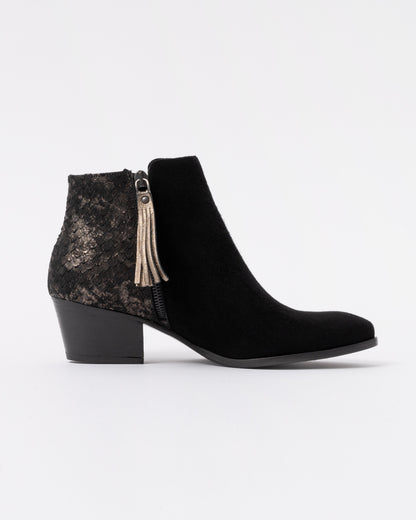 Black leather boot with a zipper on a white background