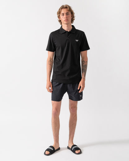 full length shot of a model wearing an Emporio Armani Mens Beach Polo with Eagle Logo in Black