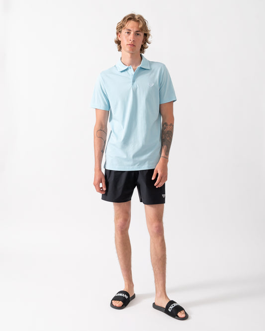 model wearing an Emporio Armani Mens Beach Polo with Eagle Logo in Sky blue
