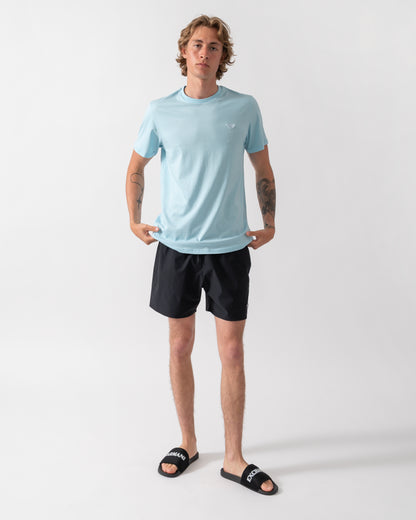 full length shot of a model wearing an Emporio Armani Mens Beach T-Shirt with Eagle Logo in Sky