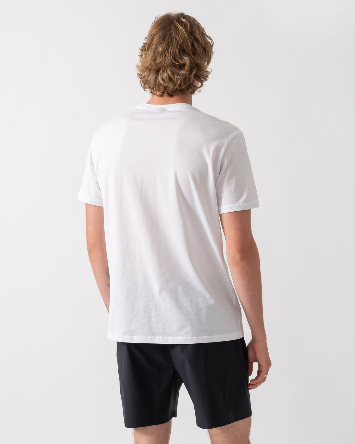 back shot of a model wearing an Emporio Armani Mens Beach T-Shirt with Eagle Logo in White