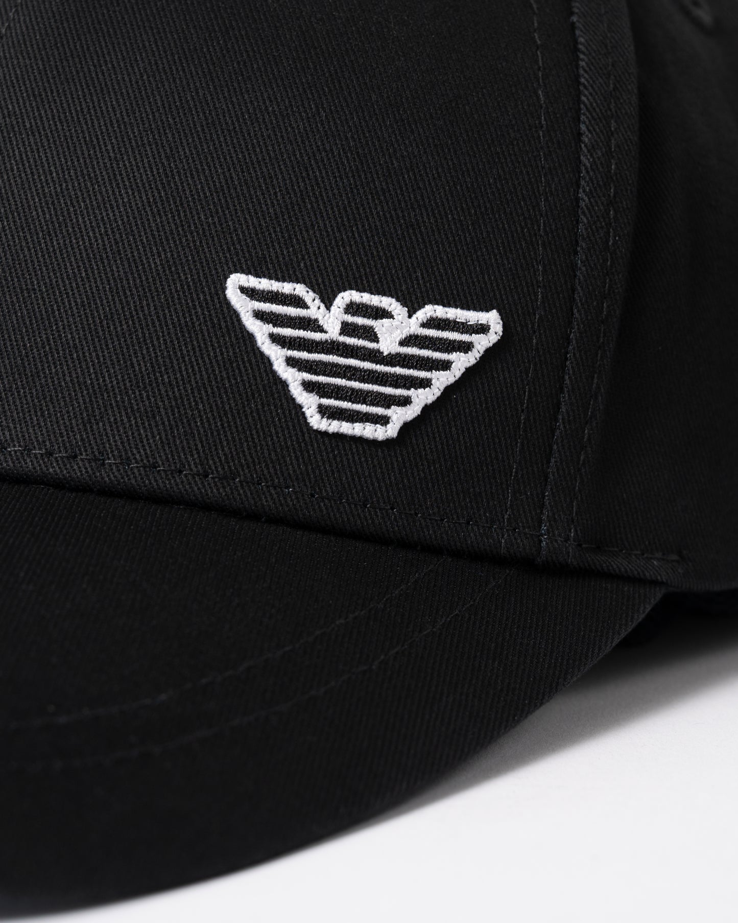 logo detail of Emporio Armani Mens Cap with Eagle Logo in Black