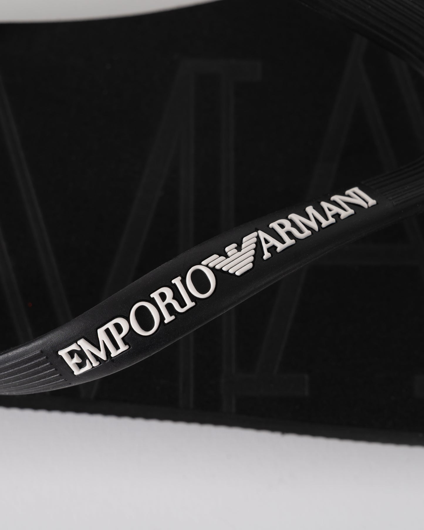 logo detail of Emporio Armani Mens Flip Flops with Logo Strap in Black and White