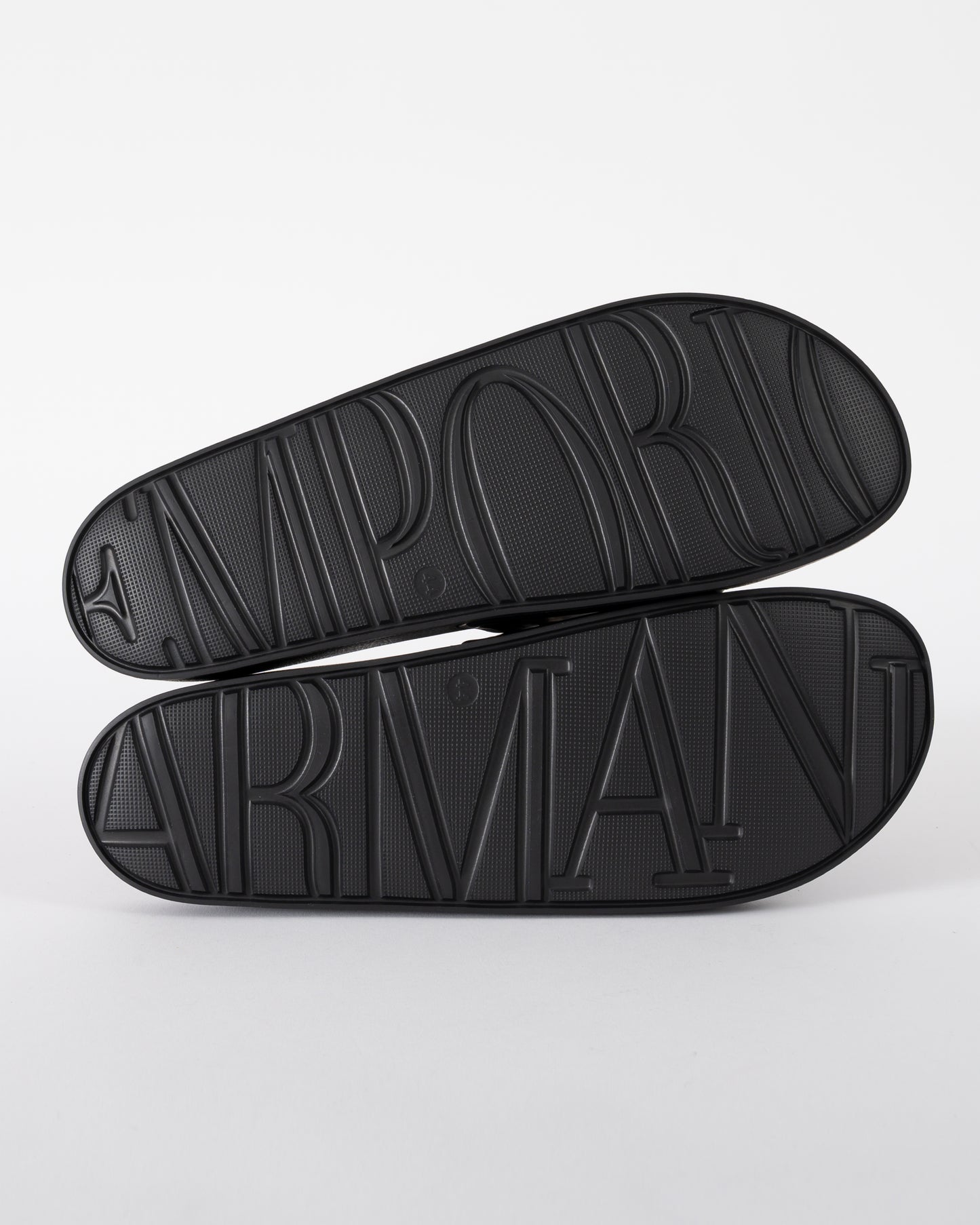 soles of Emporio Armani Mens PVC Pool Slides with Eagle Logo in Black and Whisper White