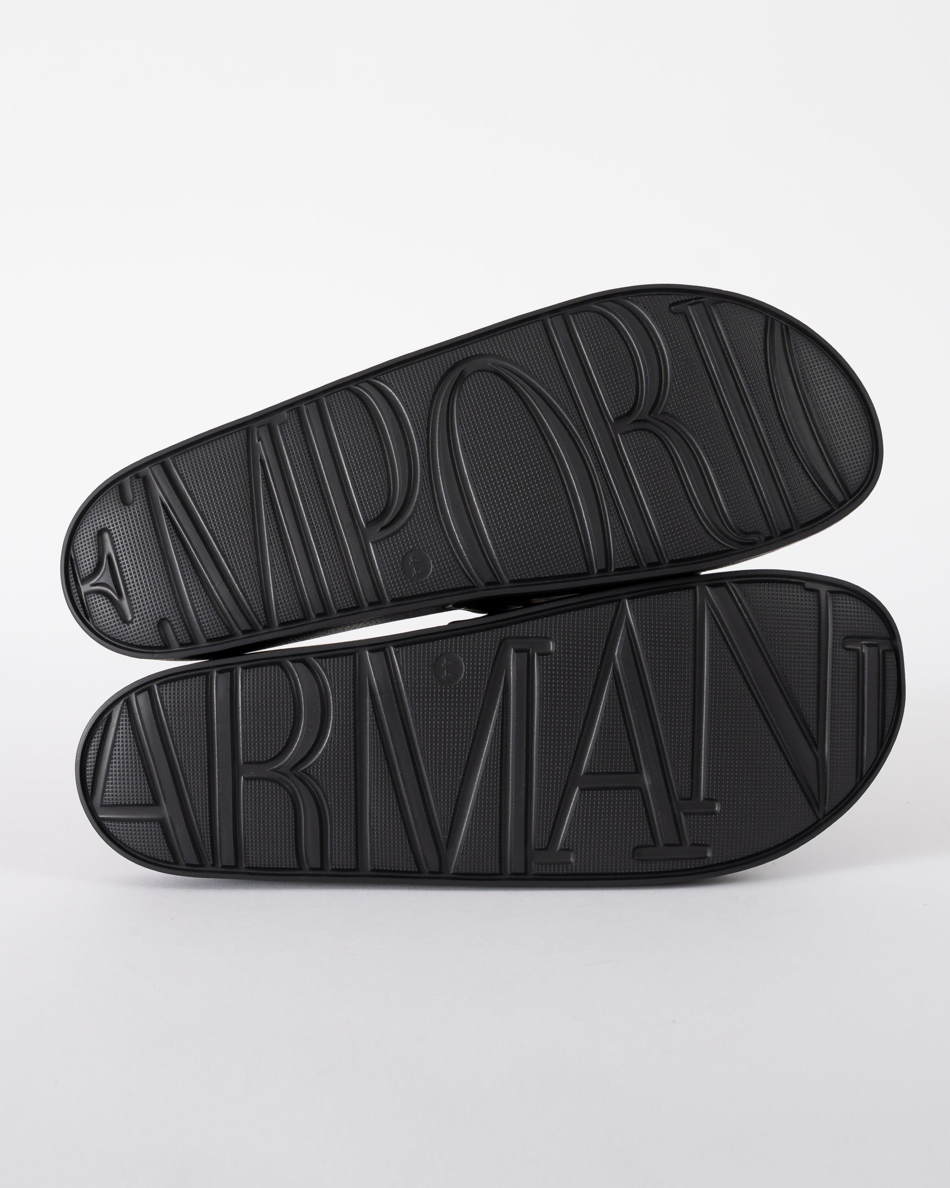 soles of Emporio Armani Mens PVC Pool Slides with Eagle Logo in Black and Whisper White