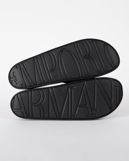 soles of Emporio Armani Mens PVC Pool Slides with Eagle Logo in Black and Whisper White