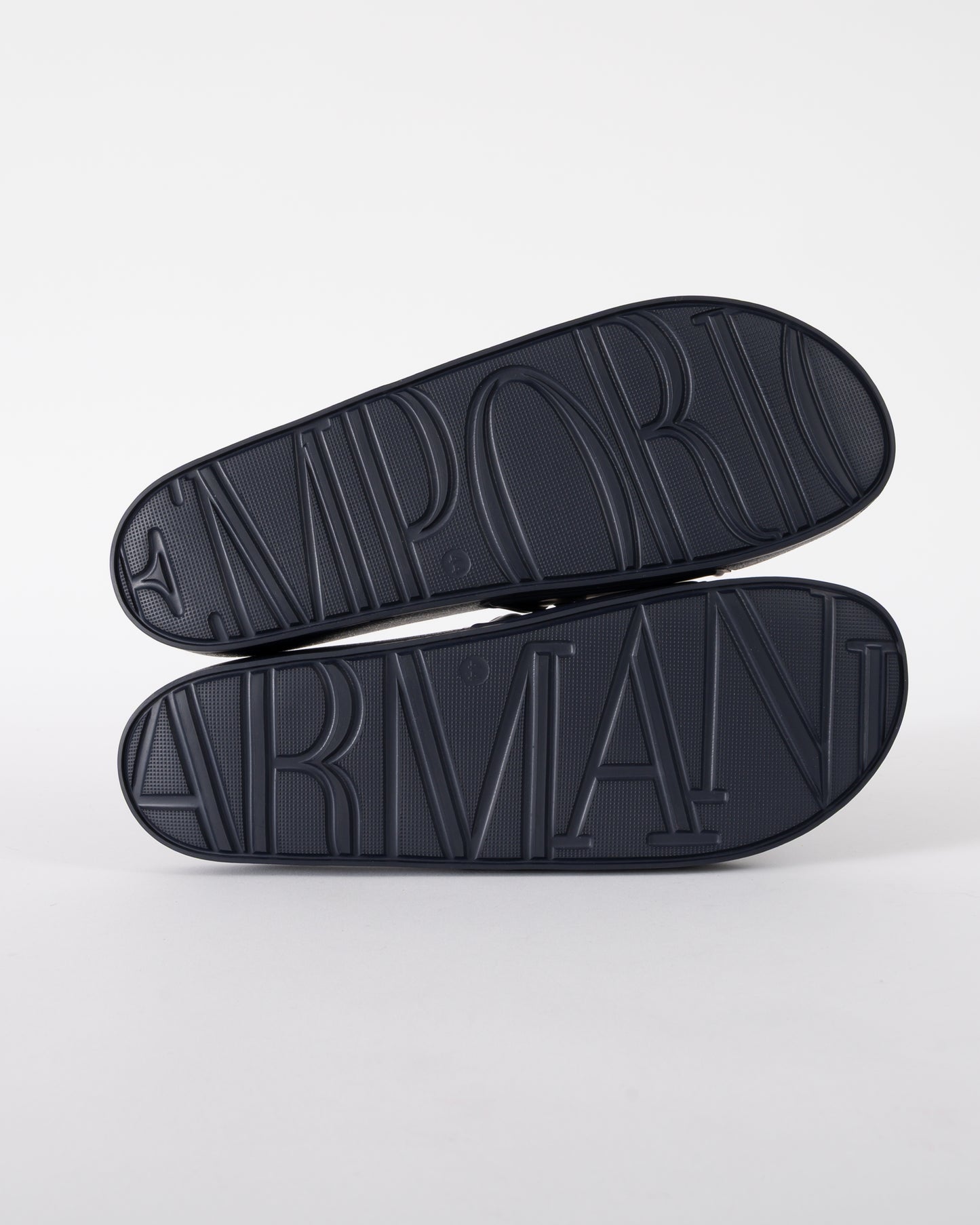 soles of Emporio Armani Mens PVC Pool Slides with Eagle Logo in Blue and Whisper White
