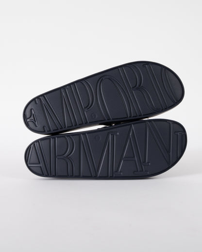 soles of Emporio Armani Mens PVC Pool Slides with Eagle Logo in Blue and Whisper White