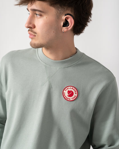 close up shot of a model wearing a Fjallraven 1960 Logo Badge Mens Sweatshirt in Misty Green 674