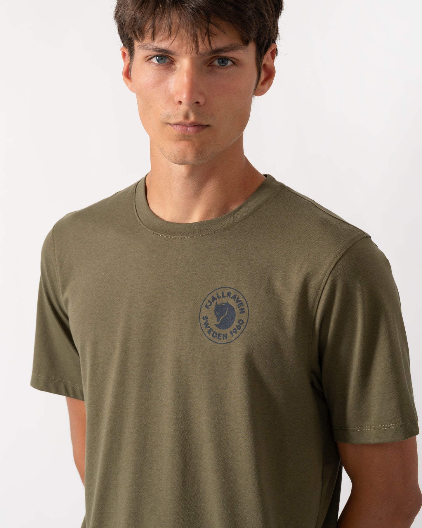 close up of a model wearing a Fjallraven 1960 Logo Mens T-Shirt in Laurel Green 625