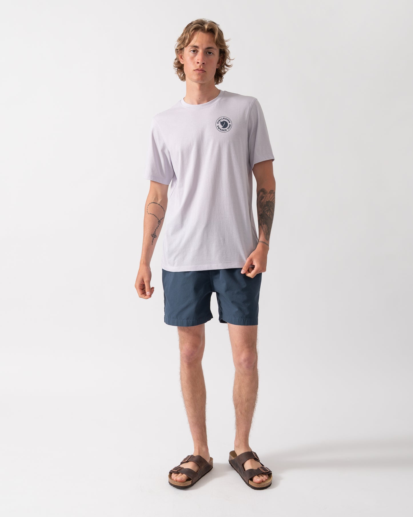 full length shot of a model wearing a Fjallraven 1960 Logo Mens T-Shirt in Lavender Mist 452