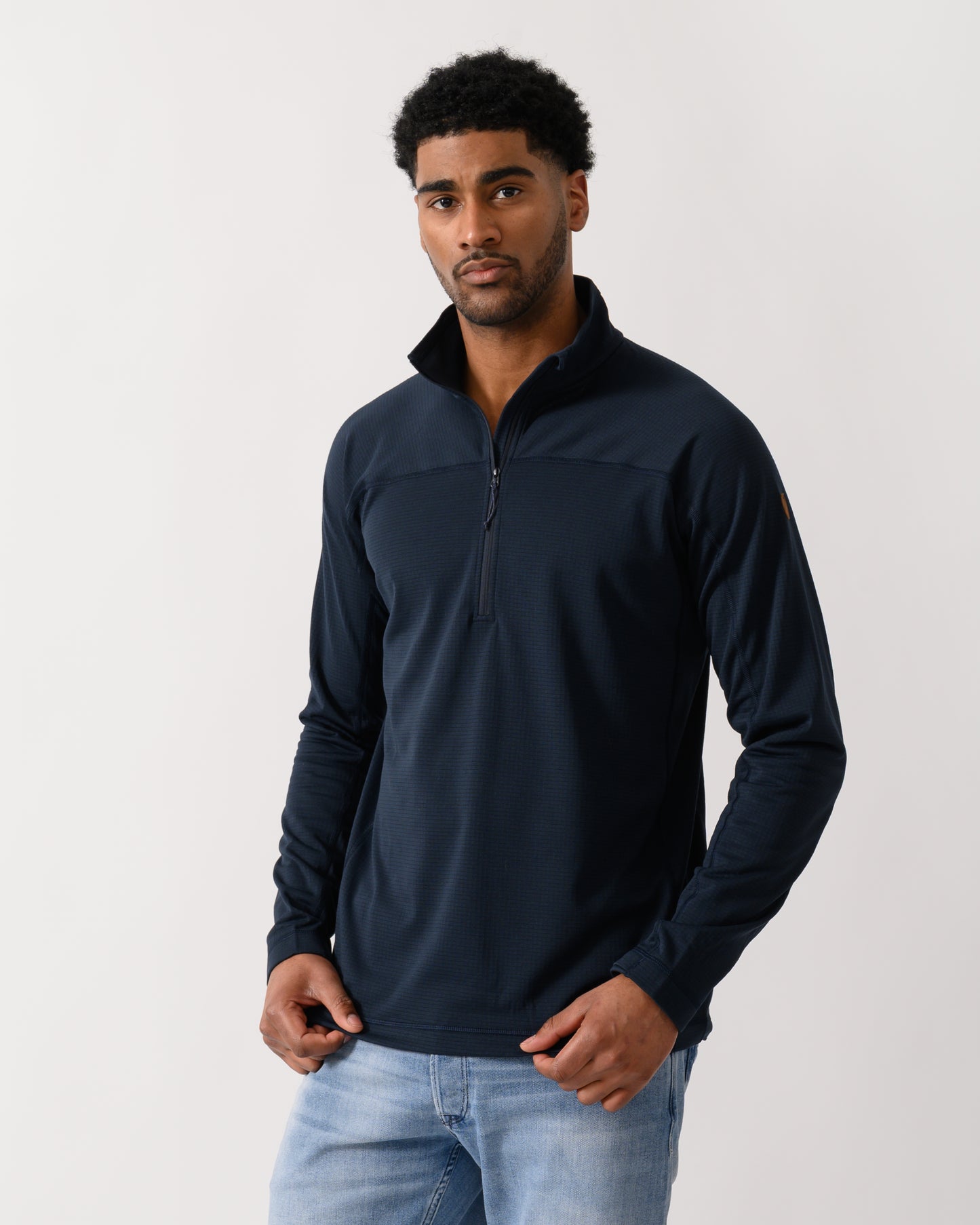 model wearing a Fjallraven Abisko Lite Fleece Half Zip Mens Sweatshirt in Dark Navy 555