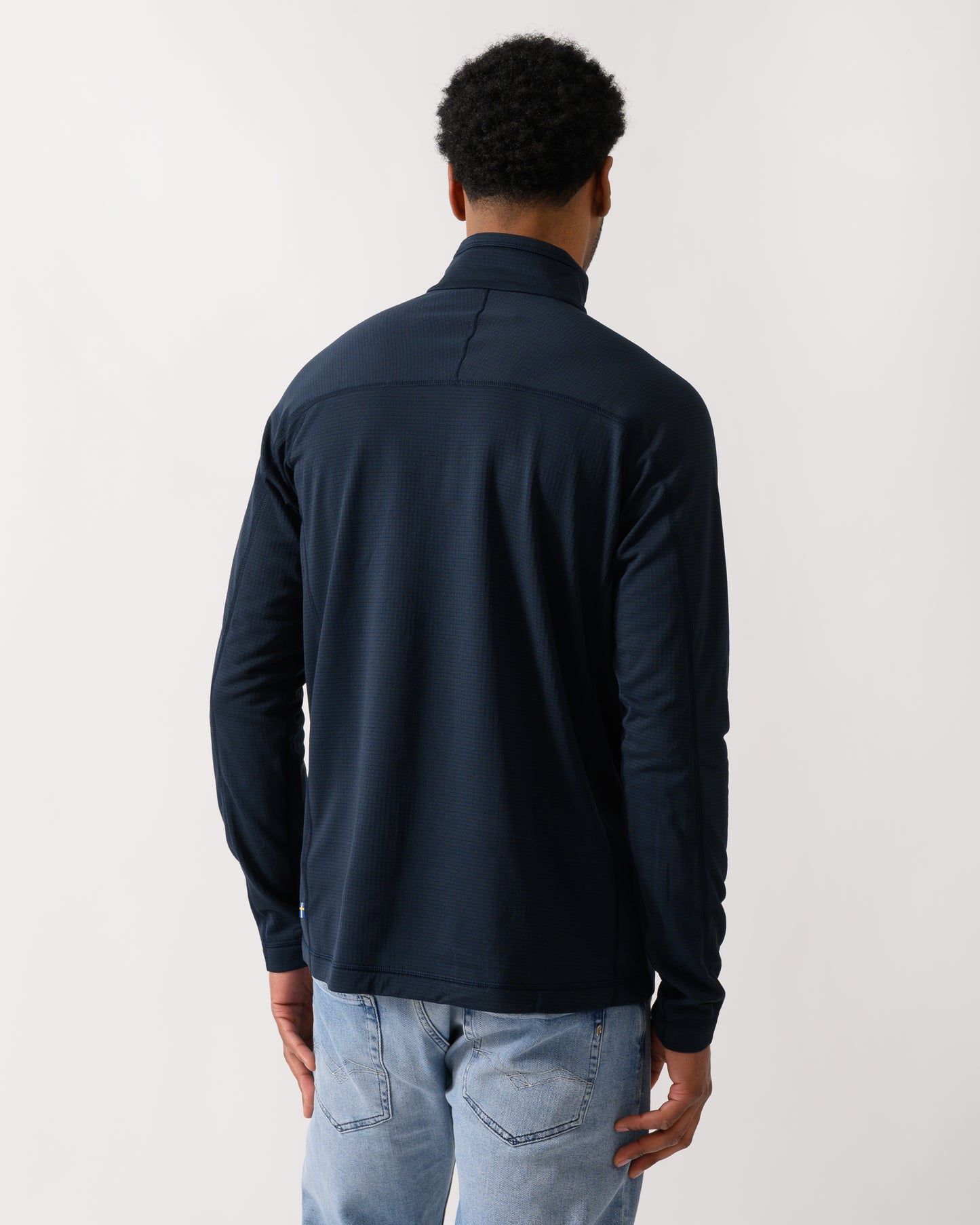 back shot of a model wearing a Fjallraven Abisko Lite Fleece Half Zip Mens Sweatshirt in Dark Navy 555