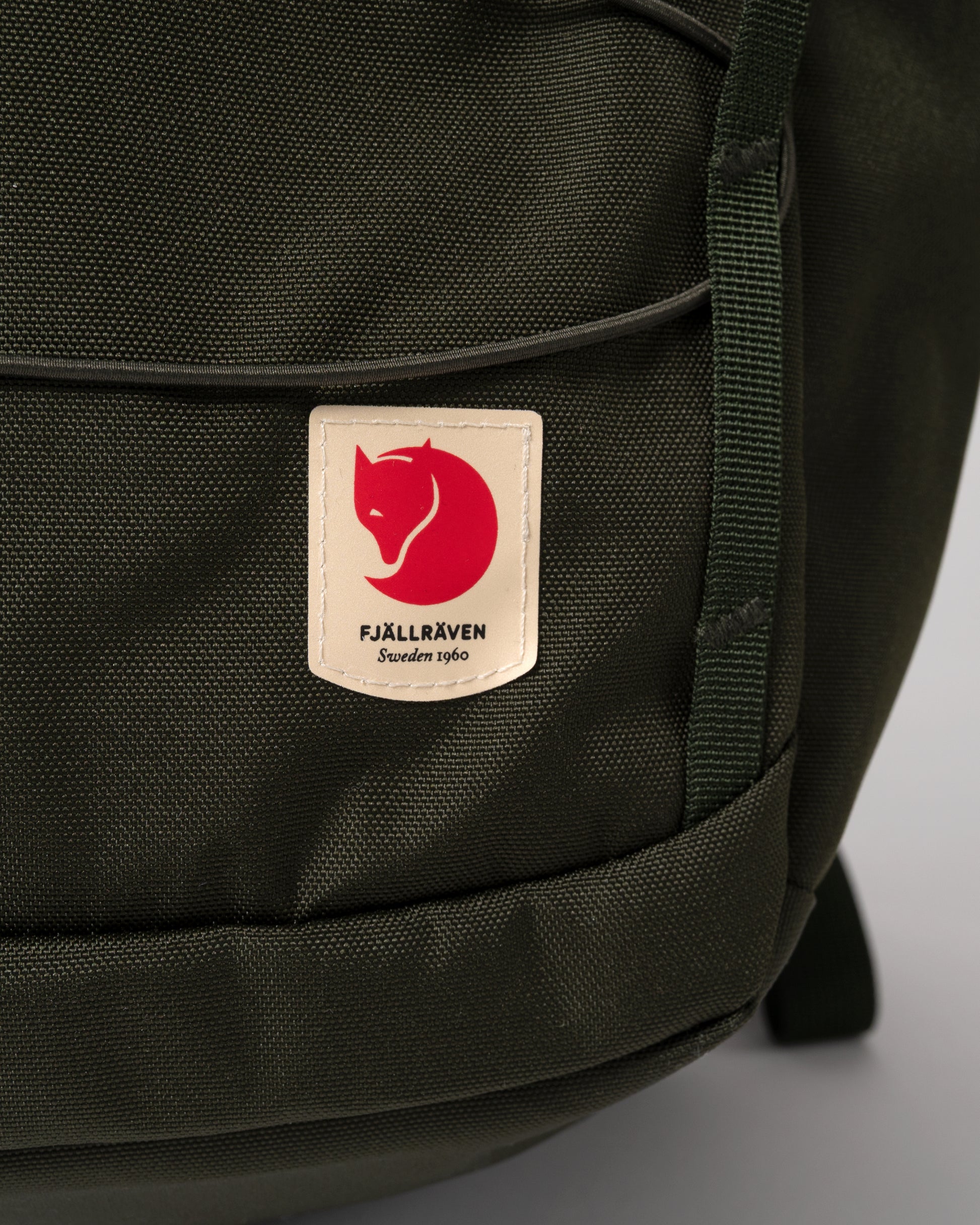 logo detail of of Fjallraven Skule 24L Unisex Backpack in Deep Forest 662