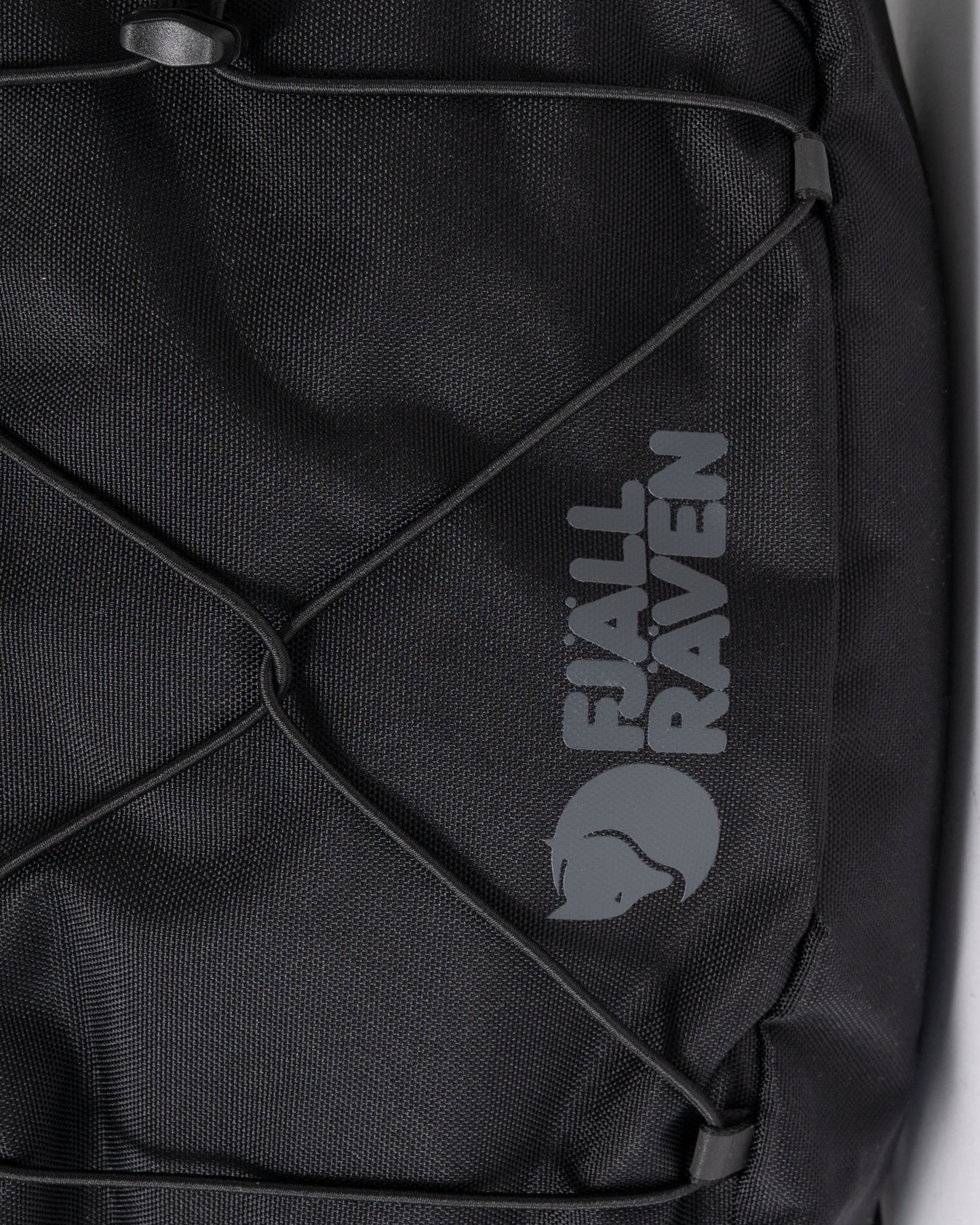 logo detai of a Fjallraven Skule 6L Unisex Sling Bag in Black 550