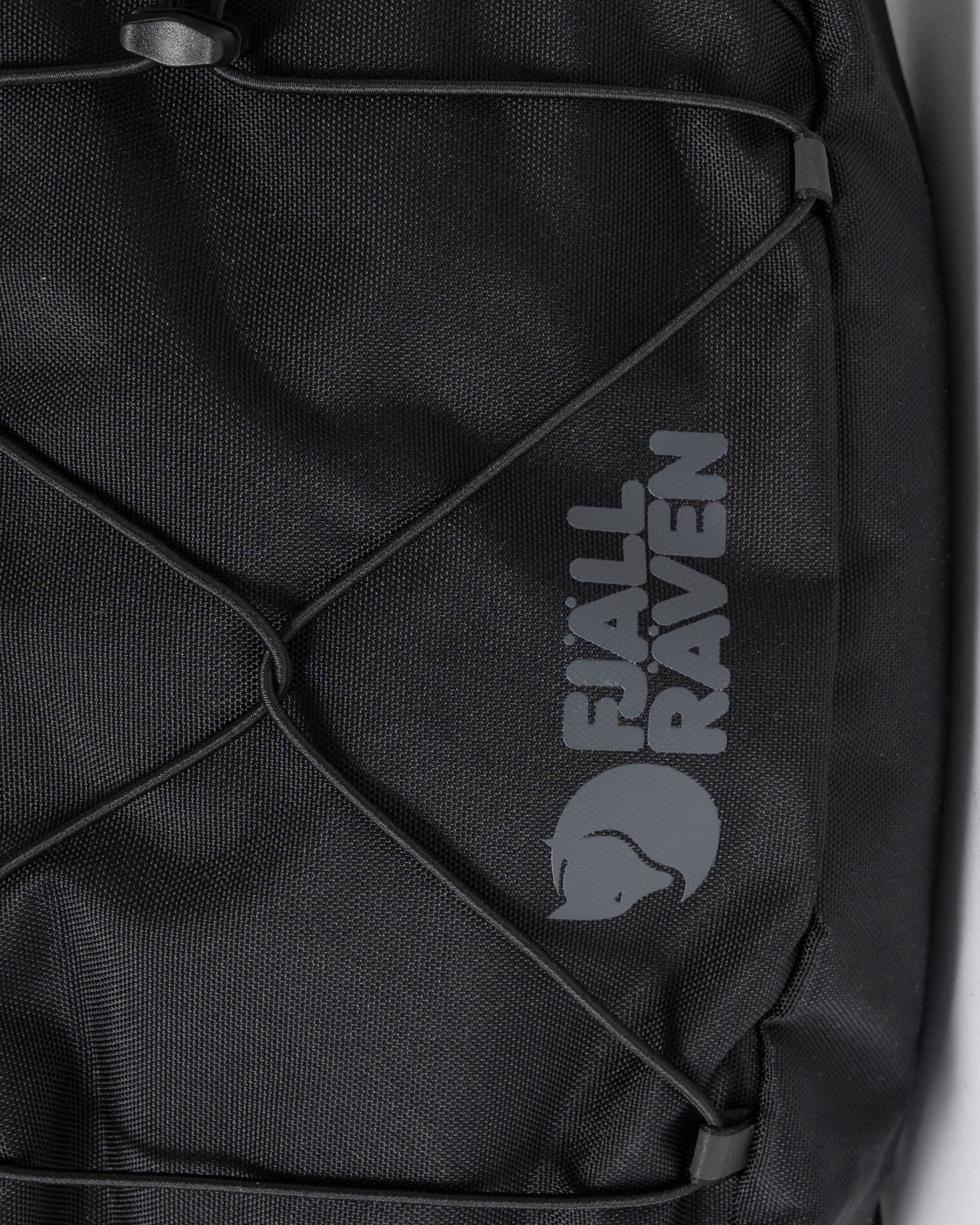 logo detai of a Fjallraven Skule 6L Unisex Sling Bag in Black 550