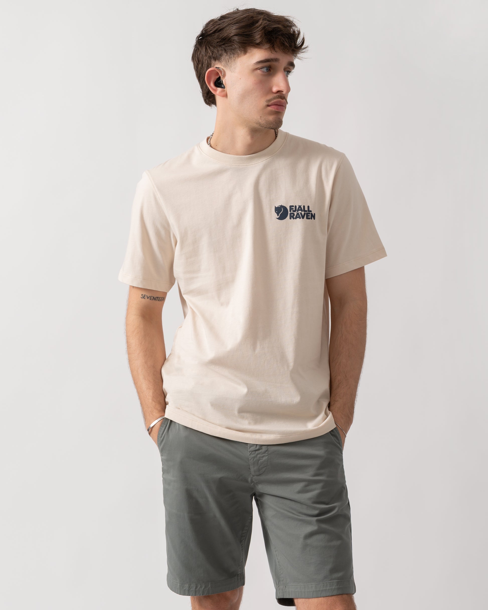 studio shot of a model wearing a Fjallraven Swedish Forest Mens T-Shirt in Chalk White 113