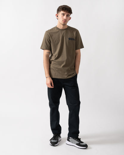 full length shot of a model wearing a Fjallraven Swedish Forest Mens T-Shirt in Laurel Green 625