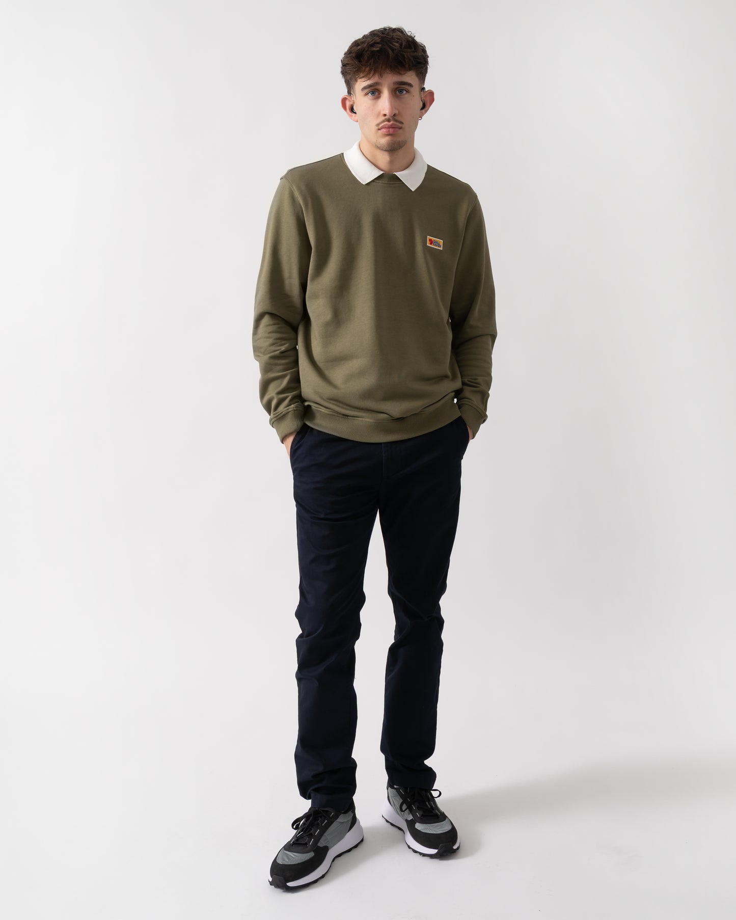 full length shot of a model wearing Fjallraven Vardag Mens Sweater in Green 620