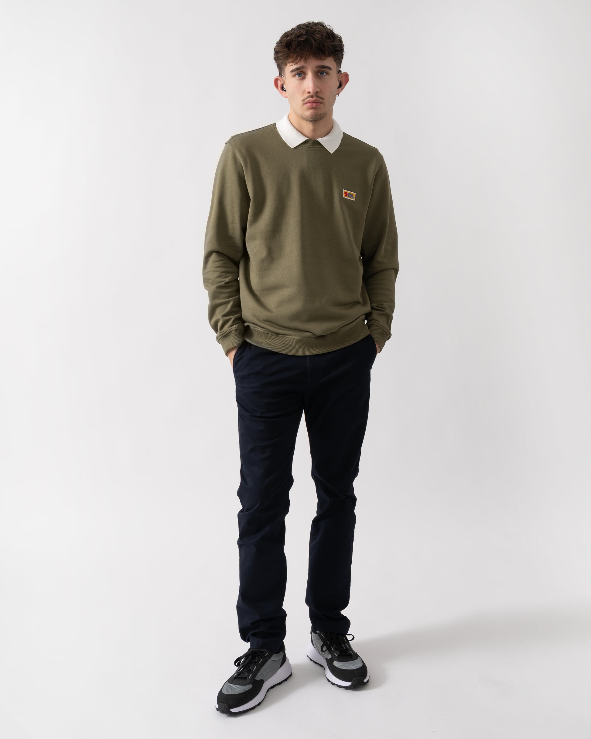 full length shot of a model wearing Fjallraven Vardag Mens Sweater in Green 620