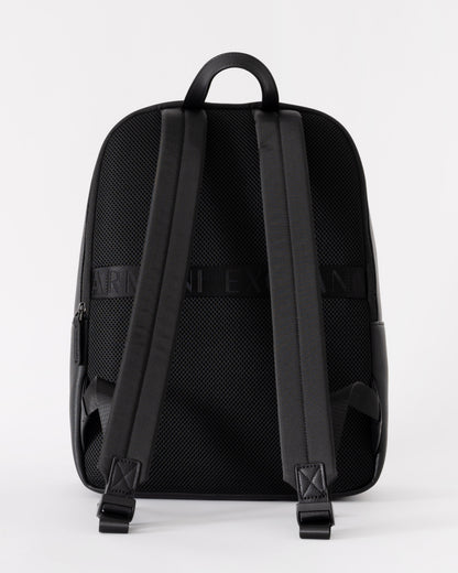 Black backpack with visible brand logo on a white background