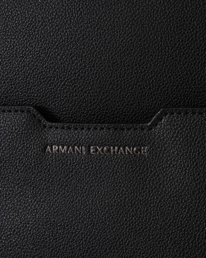 Close-up of a black Armani Exchange bag with brand logo.