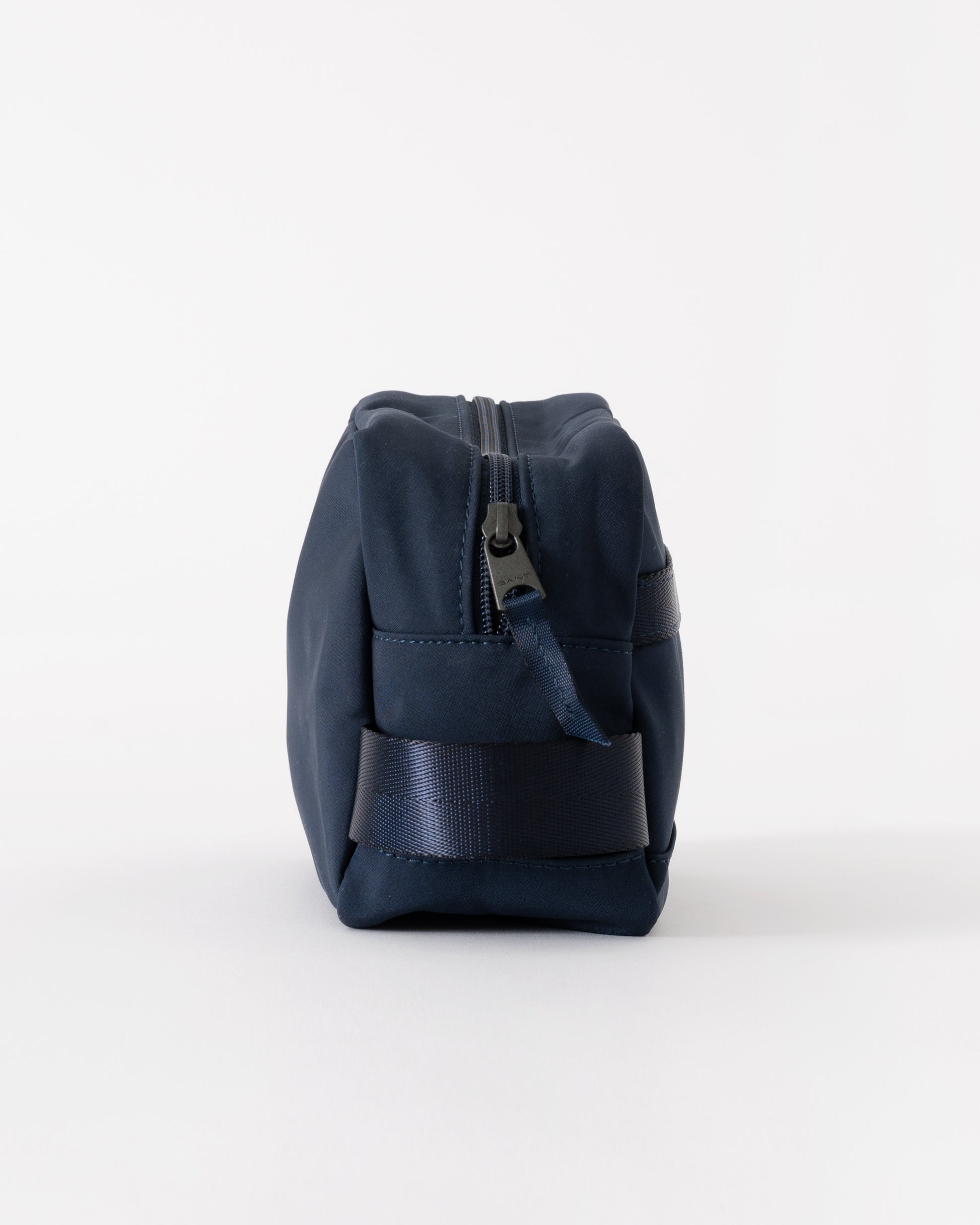 Navy blue toiletry bag on a white background