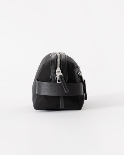 Black backpack with a visible brand logo on a white background