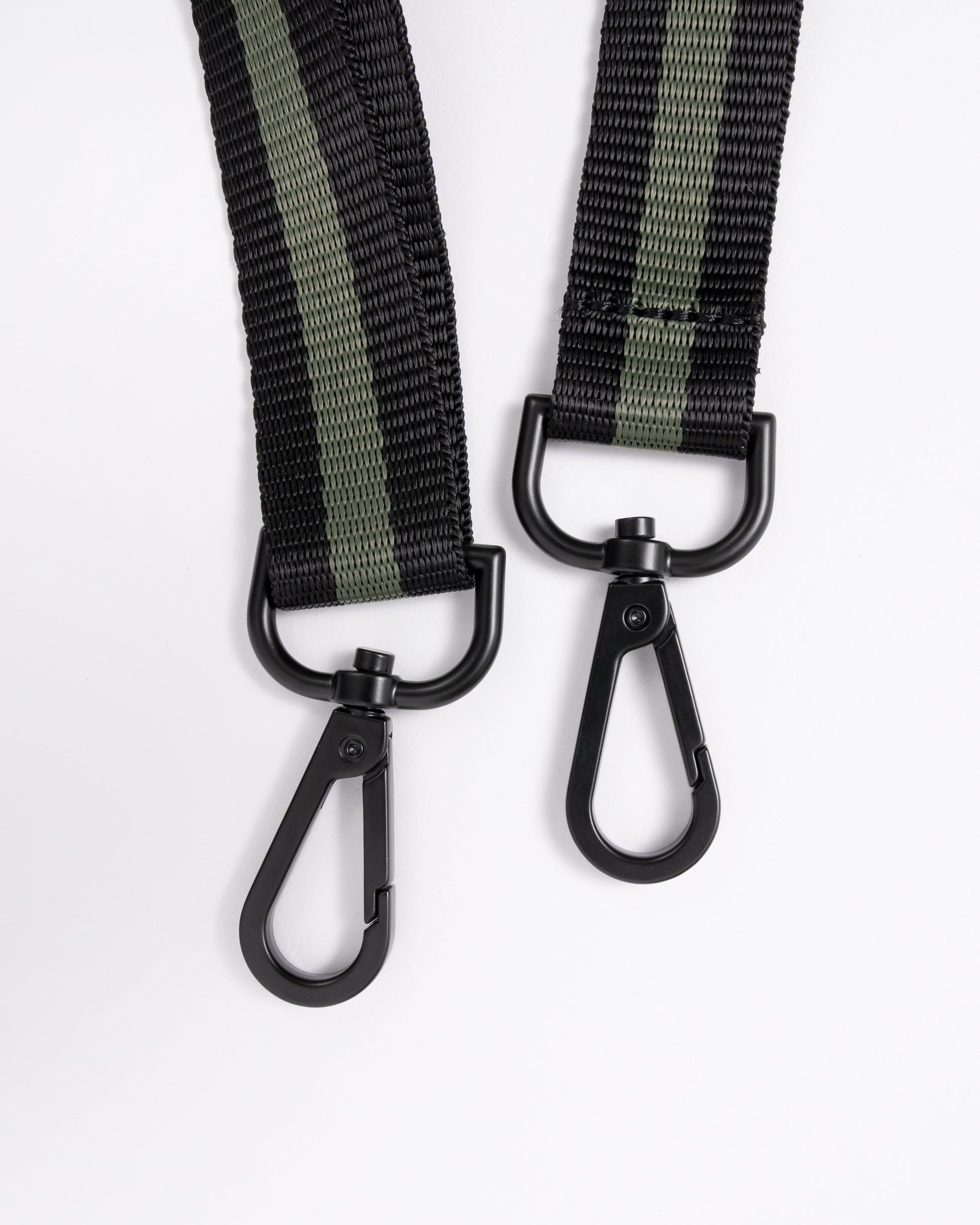 strap detail of a Fred Perry Classic Mini Barrel Bag in Laurel Wreath Green and Black Z50