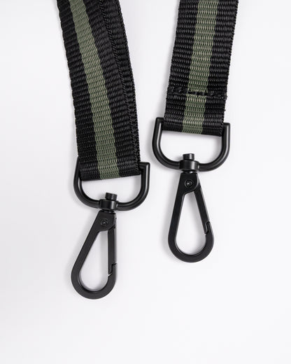 strap detail of a Fred Perry Classic Mini Barrel Bag in Laurel Wreath Green and Black Z50