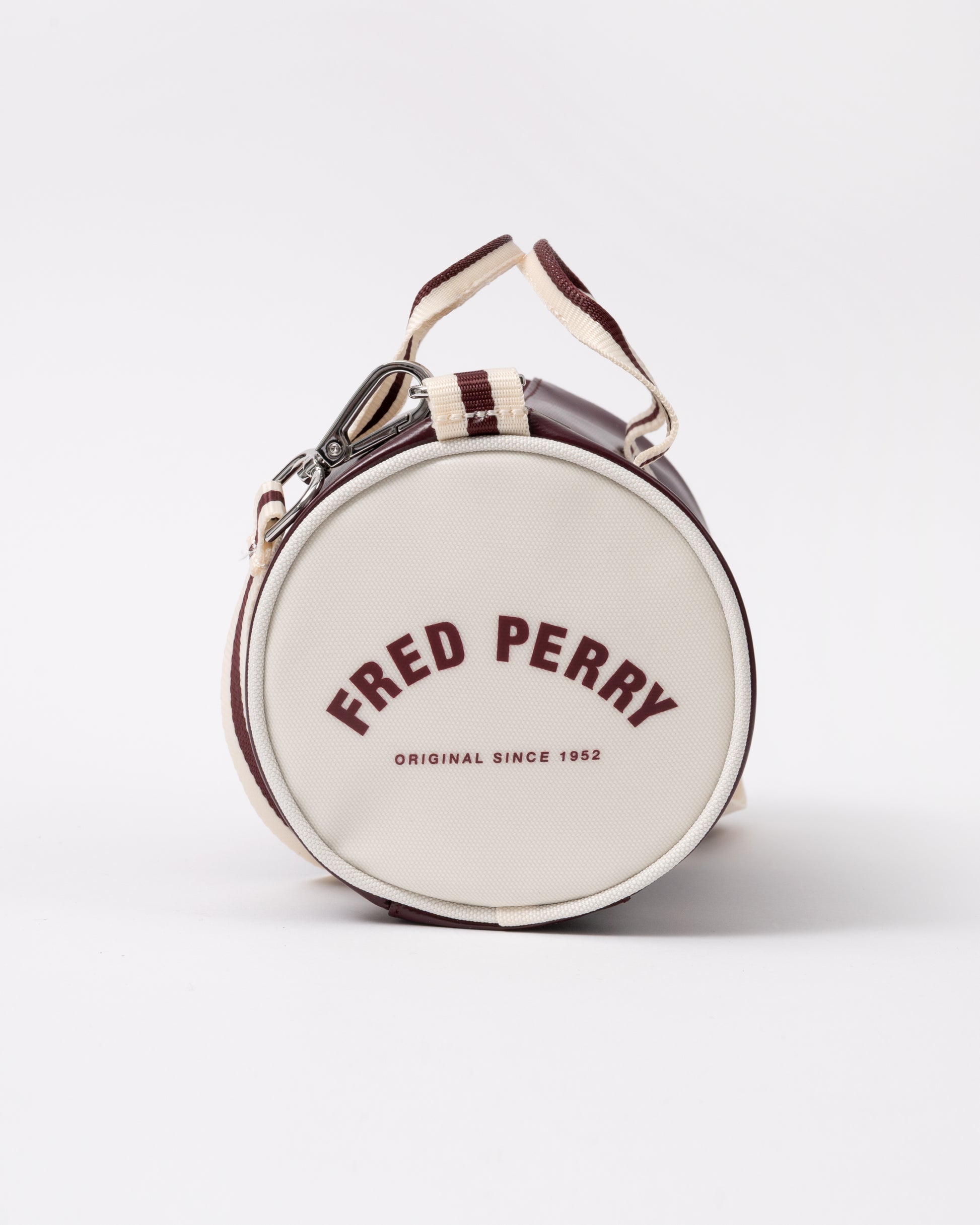 end view of a Fred Perry Classic Mini Barrel Bag in Oxblood and Ecru