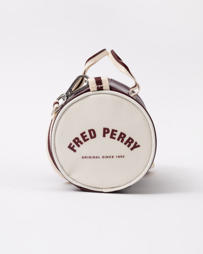 end view of a Fred Perry Classic Mini Barrel Bag in Oxblood and Ecru