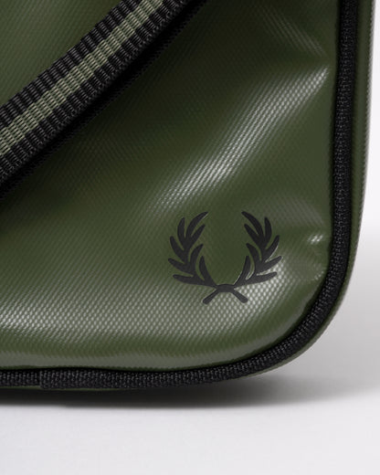 logo detail of a Fred Perry Classic Small Side Bag in Laurel Wreath Green and Black Z50
