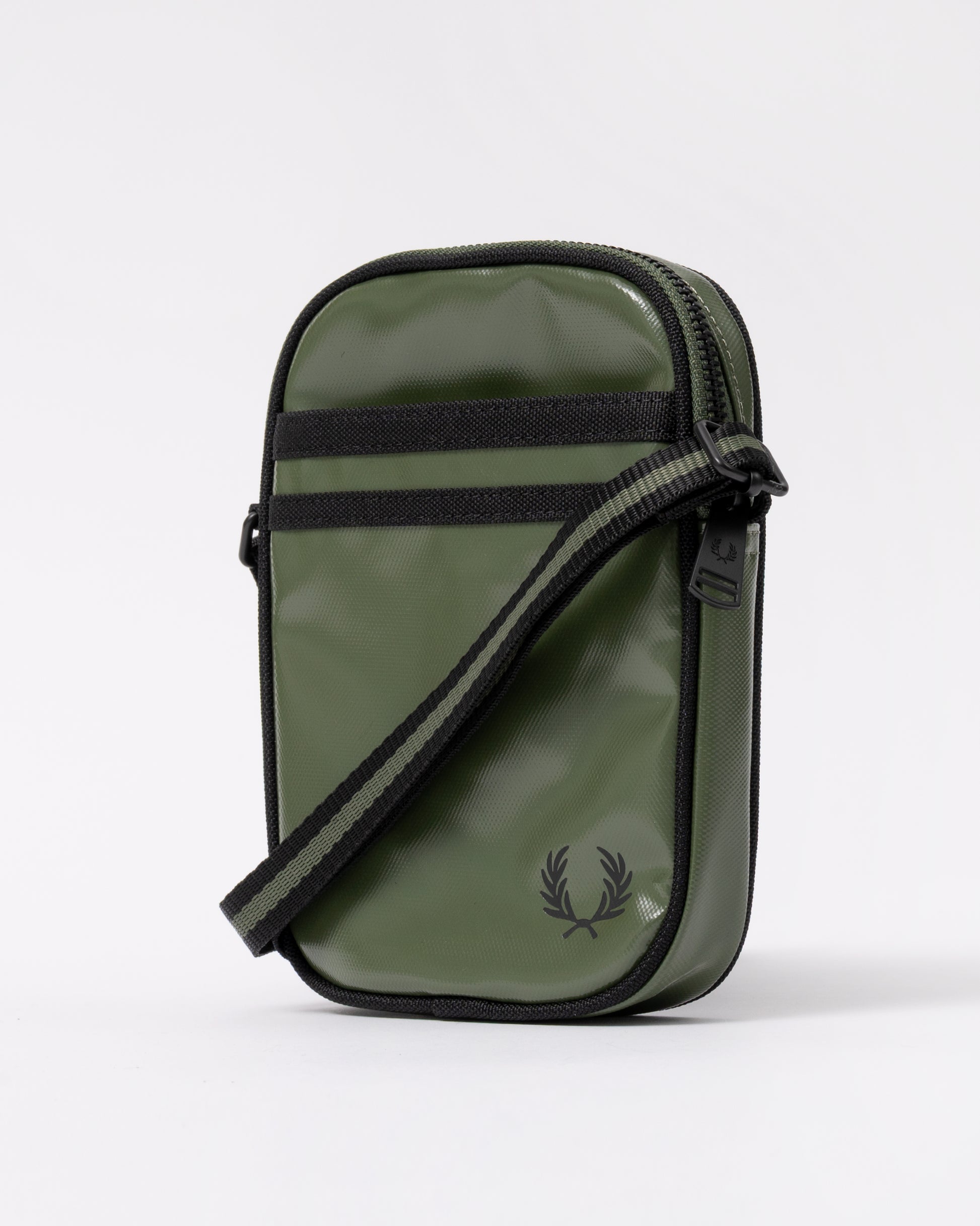 side view of a Fred Perry Classic Small Side Bag in Laurel Wreath Green and Black Z50