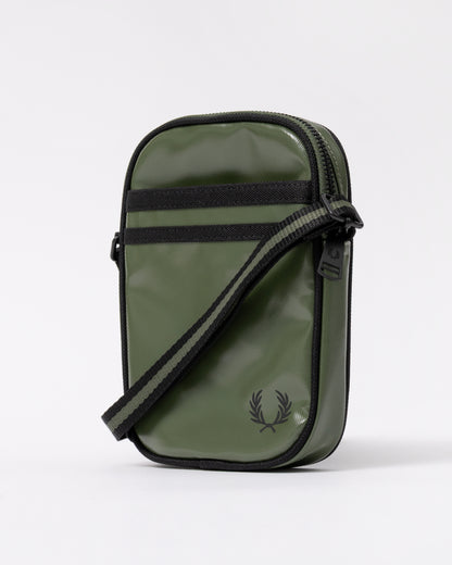 side view of a Fred Perry Classic Small Side Bag in Laurel Wreath Green and Black Z50