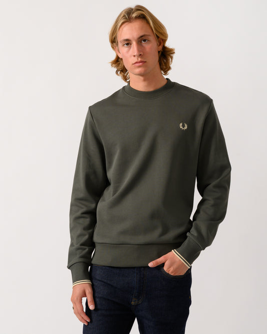 studio photograph of a model wearing Fred Perry Mens Crew Neck Sweatshirt in Field Green/Oatmeal U98