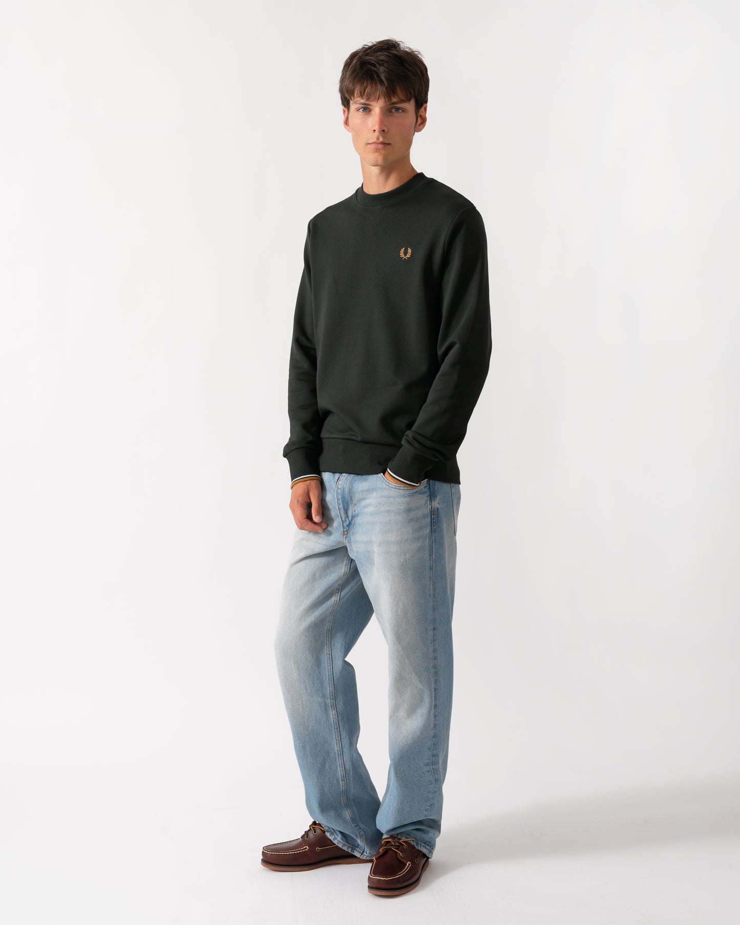 full length of a model wearing a Fred Perry Mens Crew Neck Sweatshirt in Night Green with Dusk Blue and Dark Caramel trim