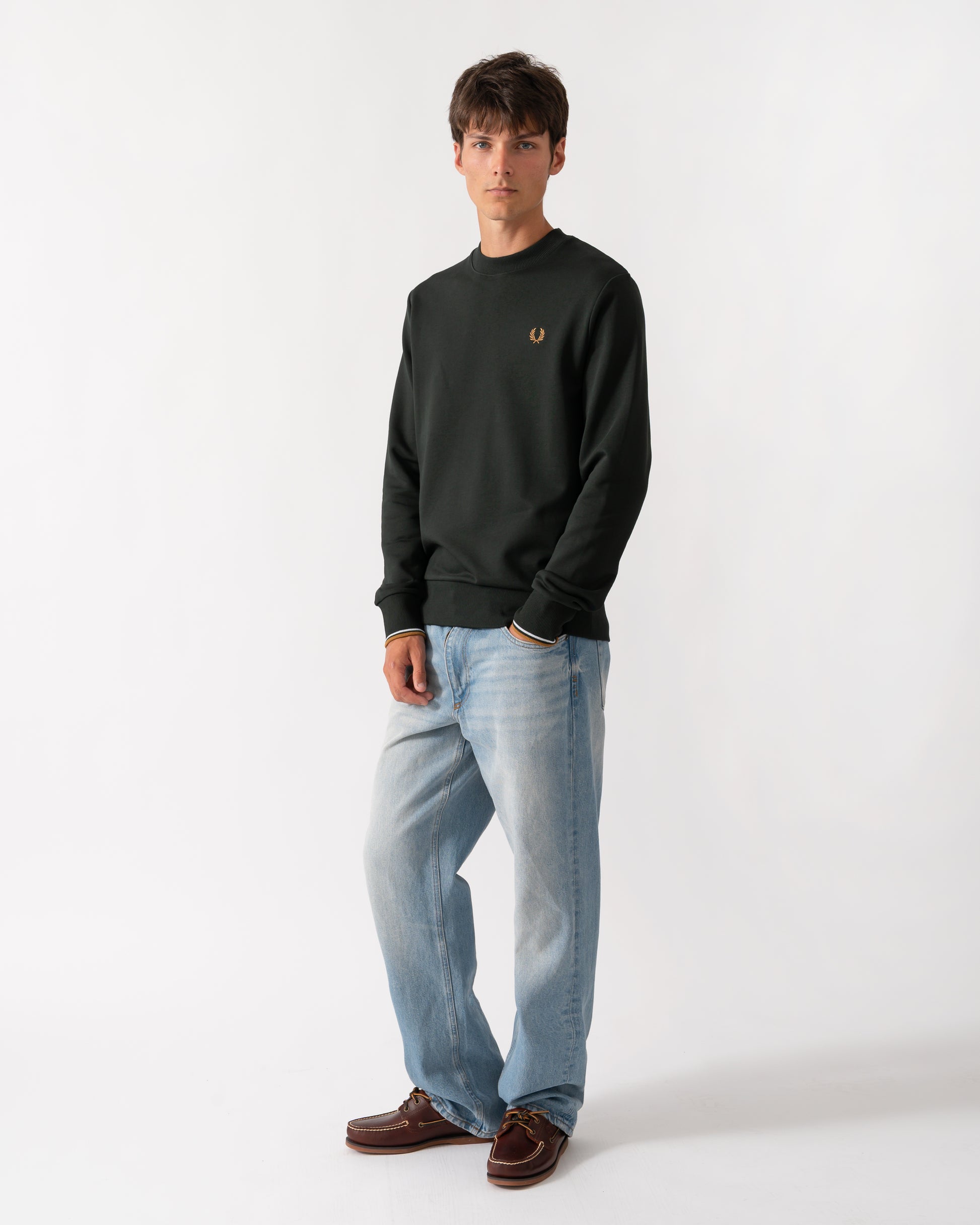 full length of a model wearing a Fred Perry Mens Crew Neck Sweatshirt in Night Green with Dusk Blue and Dark Caramel trim