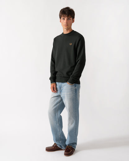 full length of a model wearing a Fred Perry Mens Crew Neck Sweatshirt in Night Green with Dusk Blue and Dark Caramel trim