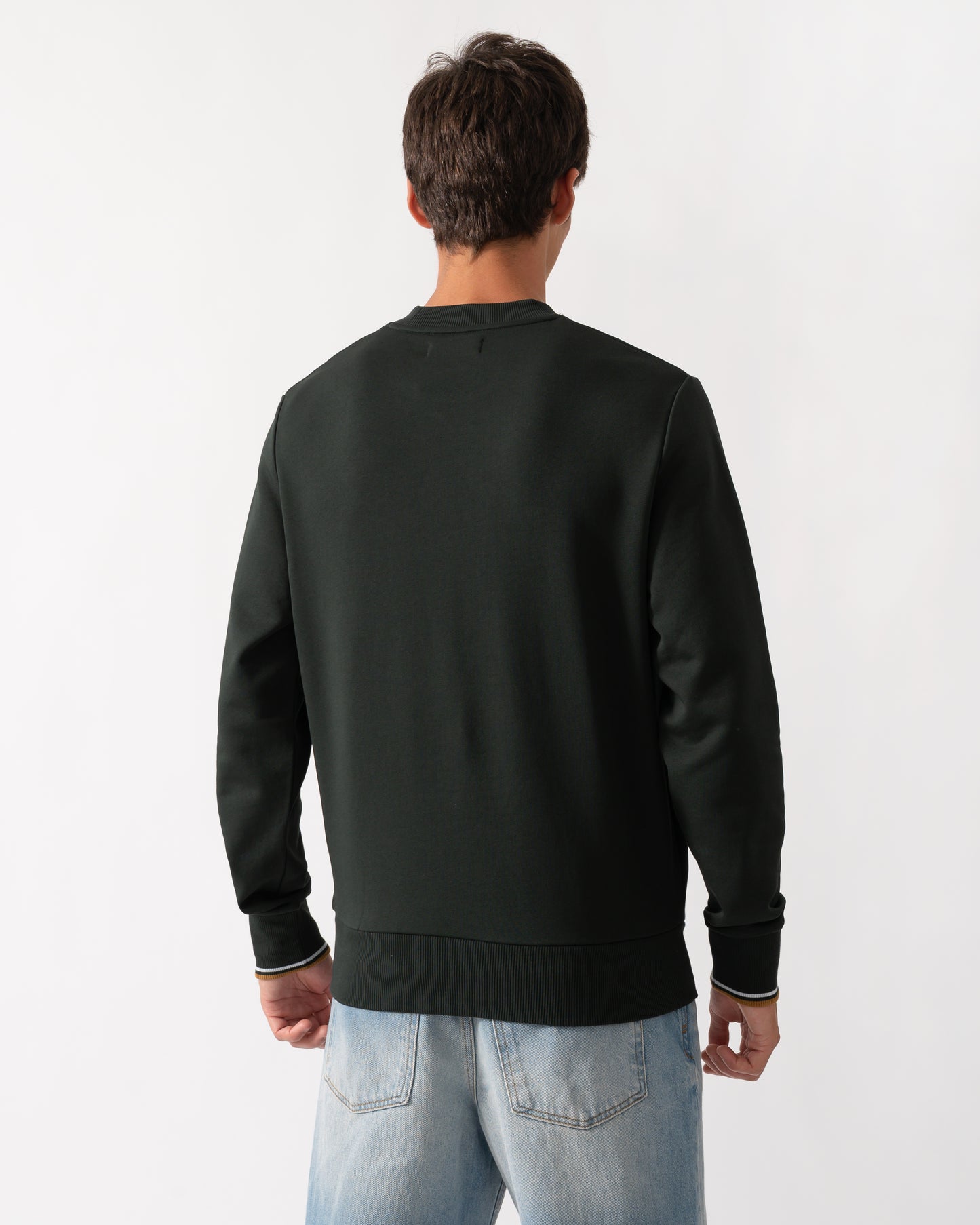 back of a model wearing a Fred Perry Mens Crew Neck Sweatshirt in Night Green with Dusk Blue and Dark Caramel trim