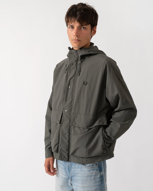 model wearing a Fred Perry Mens Cropped Ripstop Parka in Field Green D09
