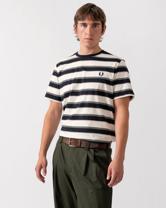 model wearing a Fred Perry Mens Fine Stripe T-Shirt in Navy 608