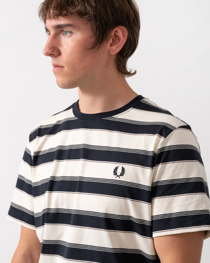 detail of a model wearing a Fred Perry Mens Fine Stripe T-Shirt in Navy 608