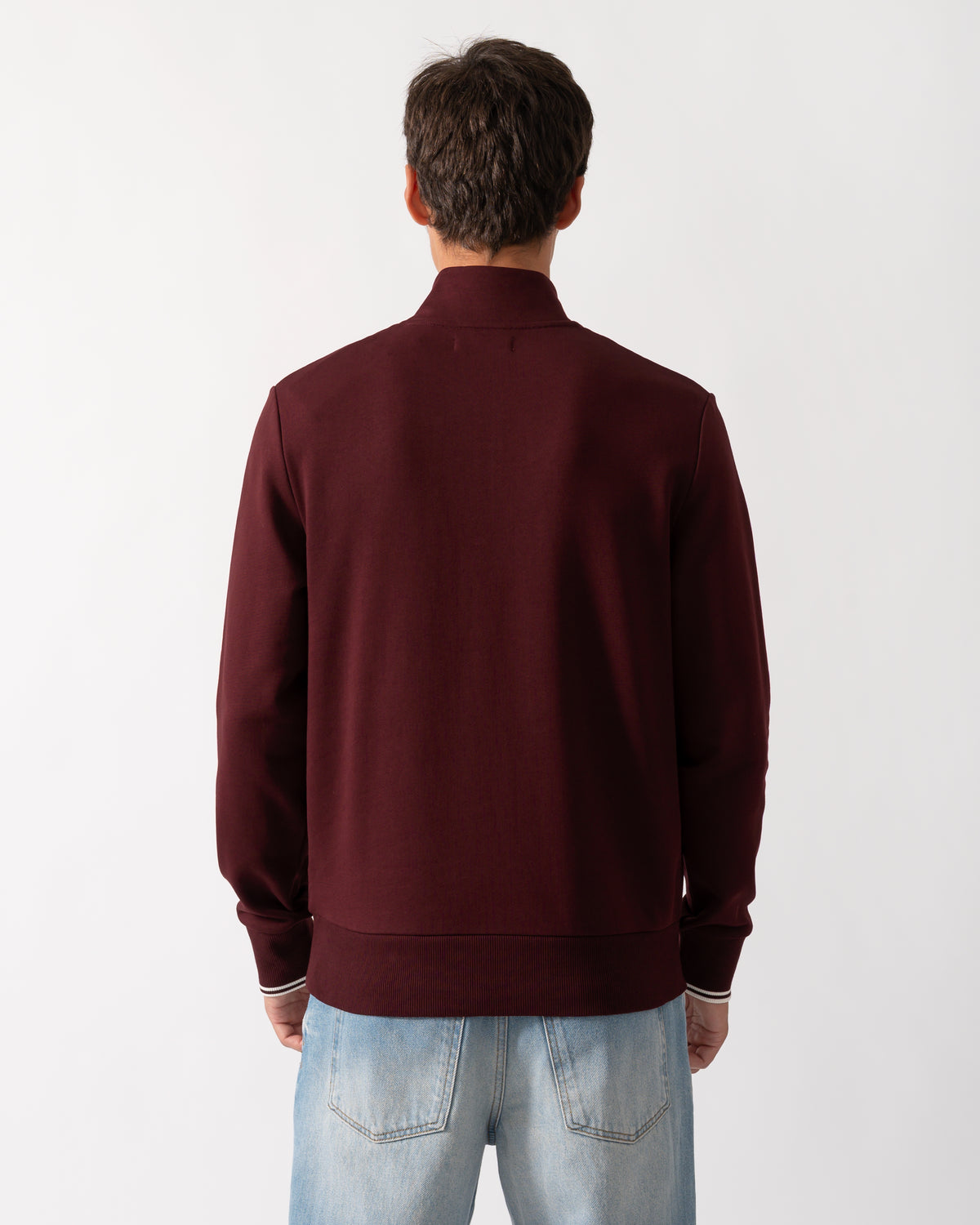 back of a model wearing a Fred Perry Mens Half Zip Sweatshirt Oxblood/Ecru 64A