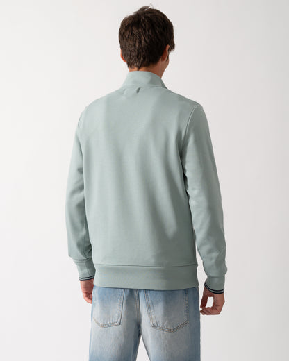 back of a model wearng a Fred Perry Mens Half Zip Sweatshirt in Silver Blue/Dark Airforce 71C