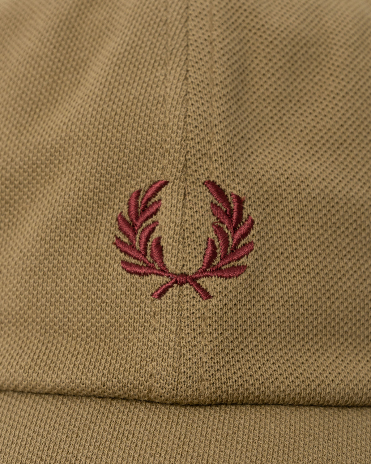 Close up of the Fred Perry Mens Pique Classic Cap - Bronze/Oxblood 62D