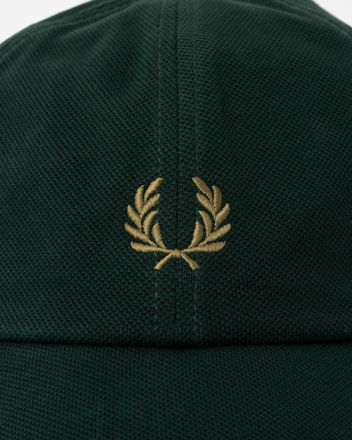 Close up of the Fred Perry Mens Pique Classic Cap - Grassroots/Bronze 86D