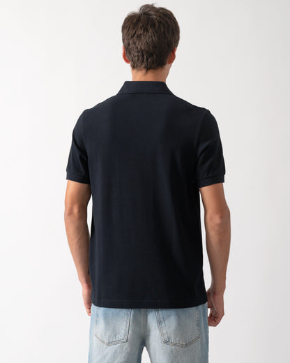 back of a model wearing a Fred Perry Mens Plain Signature Polo Shirt in Navy with Rich Brown trim