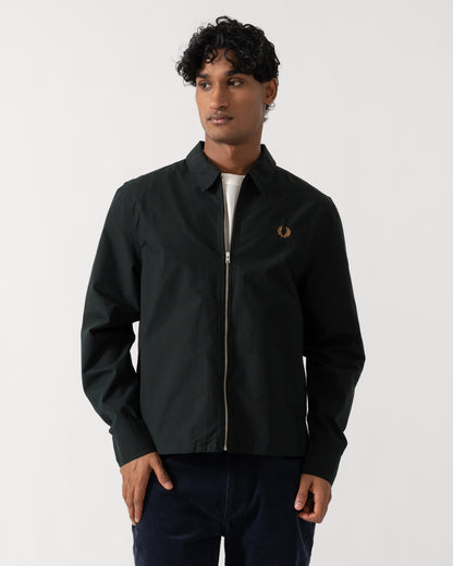 Man wearing Fred Perry Mens Poplin Zip Overshirt - Night Green Q20 zipped up