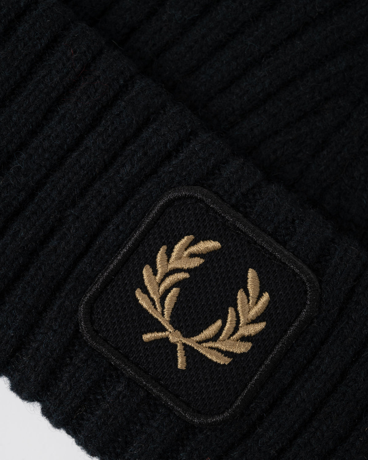 Logo on the Fred Perry Mens Ribbed Wool Beanie - Black 102